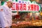 Chinese Muslim cooks prepare their meat skewers to sale to customers in front of their restaurant at famous Muslim Streein in