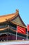 Chinese national flag waving in the main entrance in Forbidden city Beijing, China