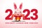 Chinese New Year 2023 greeting card. Cartoon cute rabbit holding Chinese hand scrolls with big 2023 number sign. Bunny character.