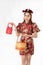 Chinese New Year concept, Woman holding a basket of food and red basket ,meaning to be happy healthy and wealthy year, Chinese New