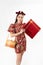 Chinese New Year concept, Woman holding a basket of food and red basket ,meaning to be happy healthy and wealthy year, Chinese New