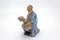 Chinese Old Man Reading Book Statue on White Background