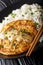 Chinese omelette Egg Foo Young served with rice close-up. vertical