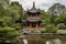 chinese pagoda surrounded by rush of water, with view of lush gardens