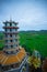 Chinese Pagoda and surrounding countryside with mountains and paddy fields at Wat Tham Khao Noi,Tha Muang District,Kanchanaburi,Th