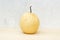 Chinese pear still life on concrete wall and plywood background