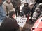 Chinese people play Xiangqi (Chinese Chess) at street side.