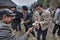 Chinese people taking rice his hands on a rural celebration.