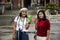 Chinese people and traveler thai women posing with beverage chinese style at Tian Tan garden of Tiantan temple at China