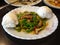 Chinese pepper steak and flower-shaped steamed buns. Popular Chinese American food.