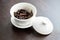 Chinese porcelain gaiwan for tea ceremony or gong fu cha or kung fu tea for brewing oolong, on wooden table or chaban with wet tea