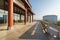 Chinese retro corridor and city skyline with red pillars under the sunlight