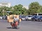 Chinese senior transports stuff on an e-bike, Beijing, China