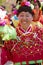 Chinese senior woman in colorful traditional silk cloth dancing