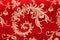 Chinese shiny ornament on red fabric