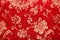 Chinese shiny ornament on red fabric