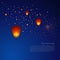 Chinese sky lanterns in a dark night background