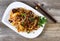 Chinese spicy beef dish in plate setting ready to eat