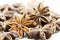 Chinese Star anise spice fruits and seeds for ingredient cooking makes food fine fragrance and essential oil on a light background