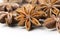 Chinese Star anise spice fruits and seeds for ingredient cooking makes food fine fragrance and essential oil on a light background