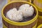 Chinese steamed dumpling in dimsum traditional bamboo container