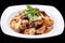 Chinese stir fry chicken and mushroom isolated on black background, chinese cuisine