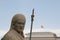 Chinese stone soldier next to china flag