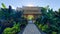 Chinese Style Archway Entry to a Garden with Lush Tropical Plants and Foliage