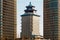 Chinese-style building Beijing Tower between two Talan Towers on a sunny day in Astana, Kazakhstan