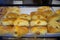 Chinese style sausage hot dog bun, topped with meat floss, for sale at a foodcourt