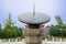 Chinese sundial in sky of sunny summer afternoon