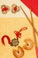 Chinese talismans with fortune cookies and chopsticks on golden surface, Chinese New Year concept