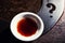 Chinese tea cup question mark stone background