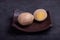 Chinese tea eggs, cut or whole marinated eggs in dark background
