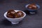 Chinese tea eggs, cut or whole marinated eggs in dark background