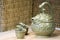 Chinese teapot and green dragon greedy cups