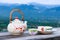 Chinese teapot and teacups on wood table.