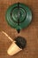 Chinese teapot and a wicker scoop with herb tea le