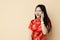 Chinese teen girl phone calling with friend dressing Qipao traditional cloth