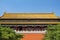 chinese temple with red wall and columns on blue sky background. Translation: \\\