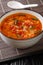 Chinese tomato egg drops soup close-up in a bowl. vertical