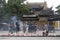 Chinese tourists burning incense at buddhist temple