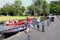 Chinese tourists walking electric boat canal, Giethoorn, Netherlands