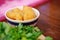 Chinese tradition food- Fried bread stick, Youtiao or Chinese crullers contained in a bowl and placed on wooden table