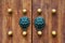 Chinese traditional doorknob and wooden doors. Old handle of metal on a wooden old door. Door knocker in the shape of a