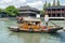 Chinese traditional rowboat in the Dianpu River in Zhujiajiao Ancient Water Town, a historic village in Shanghai, China