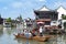 Chinese traditional rowboat in the Dianpu River in Zhujiajiao Ancient Water Town, a historic village in Shanghai, China