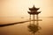 Chinese traditional wooden gazebo on the coast of West Lake, public park in Hangzhou city, China