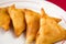 Chinese triangle pies on white plate