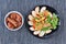 Chinese Vegetable festival food as fried ginkgo with mixed vegetables served with fried tofu and fermented flour in brown soup ,